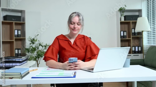 Successful businesswoman in modern office working on laptop.for doing math finance on an office desk, tax, report