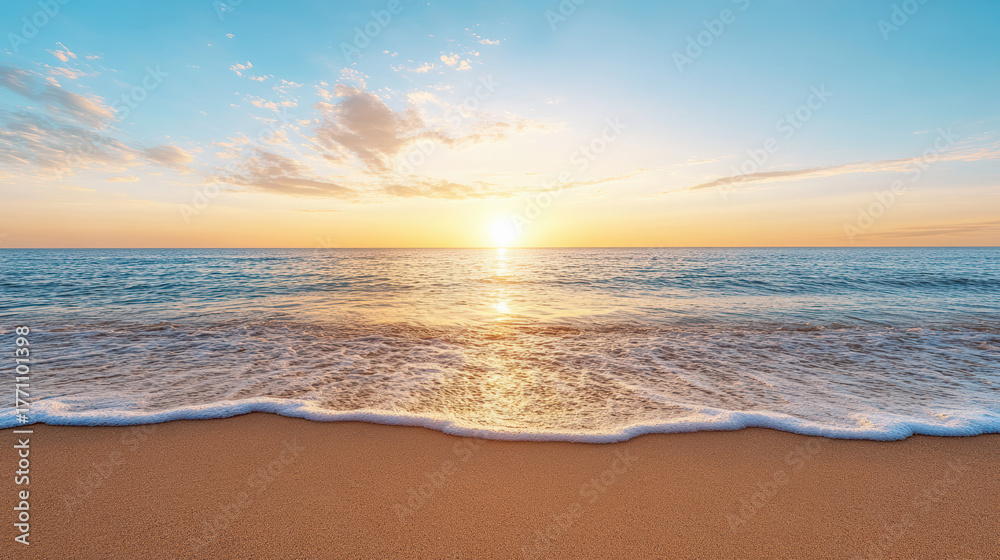 Fototapeta premium Sunset over ocean waves gently lapping on sandy shore creates tranquil atmosphere