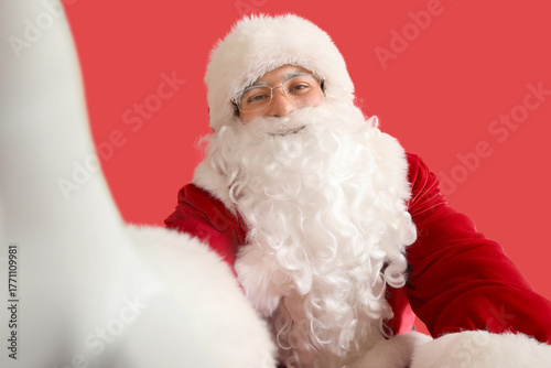 Santa Claus taking selfie o...