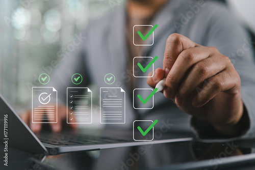 Prepare check and approve concepts. Document management, paperless. Man touching on virtual screen to tick mark documents for online approve paperless quality assurance and ERP management.