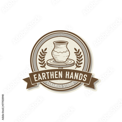 A handcrafted logo design depicting a pottery wheel with a vessel, wheat, and banner