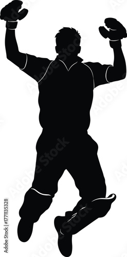 Silhouette of a triumphant baseball catcher jumping with arms raised