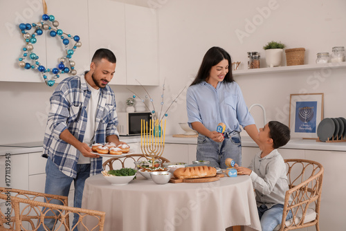 Happy family having dinner ...