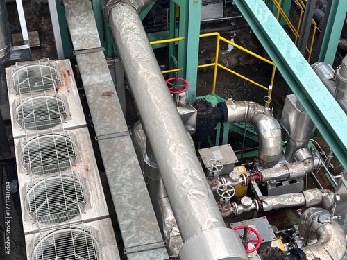 Canvas Print Aerial view of a commercial rooftop mechanical area, featuring large cylindrical