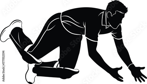 Silhouette of a cricket player diving to catch the ball