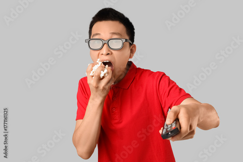 Emotional young Asian man w...