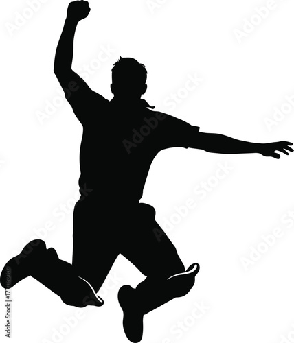 Silhouette of a triumphant athlete jumping with arms raised in celebration