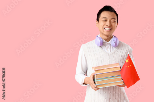 Young Asian man with flag o...