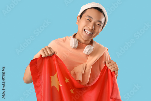 Young Asian man with flag o...