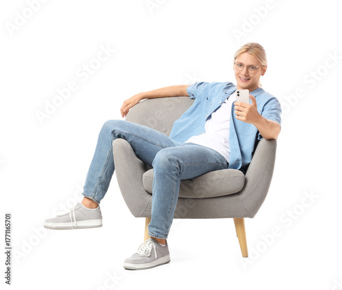 Young man using mobile phon...