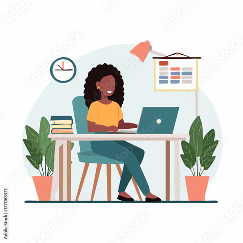 A woman is sitting at a desk, working on a laptop in a bright office environment.