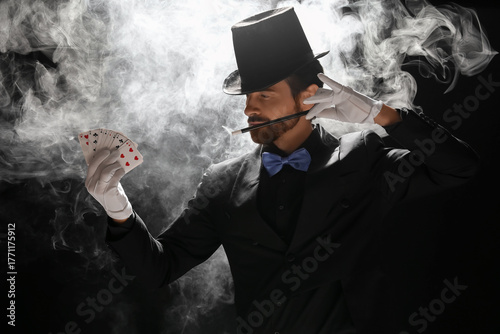 Male magician with playing ...