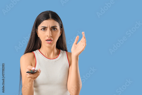 Shocked young woman with re...