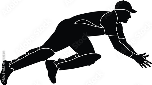 Silhouette of a cricket player diving to catch a ball