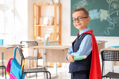Cute little schoolboy with ...