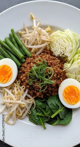 Delicious Noodle Dish with Fresh Vegetables and Boiled Eggs.