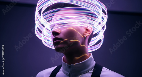 Futuristic portrait of a person with glowing light trails swirling around their head in a dark setting creating a surreal and innovative visual effect for technology themes