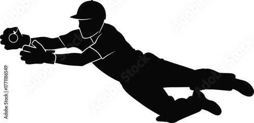 Silhouette of a baseball player diving to catch a ball
