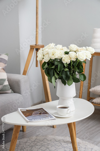 Vase with white roses, cup ...