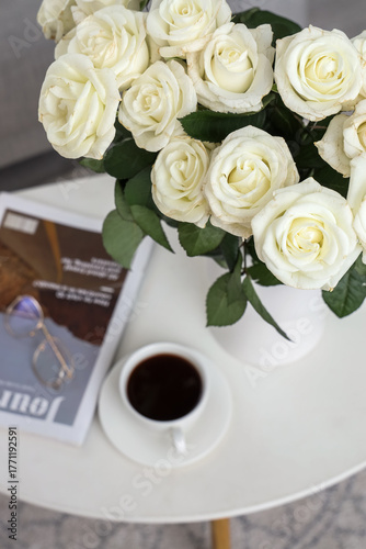 Vase with white roses, cup ...