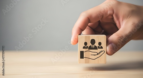 Human Resources Support Hand Holding Block with People Icons for HR Assistance