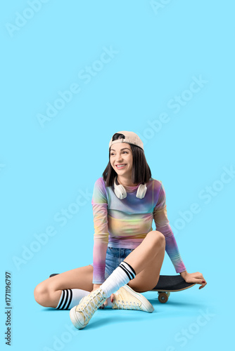 Young woman with skateboard...