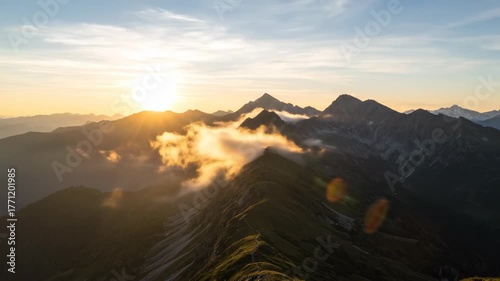 Timelapse of misty clouds sweeping over a serene mountain range at sunrise scenic, dawn, misty clouds