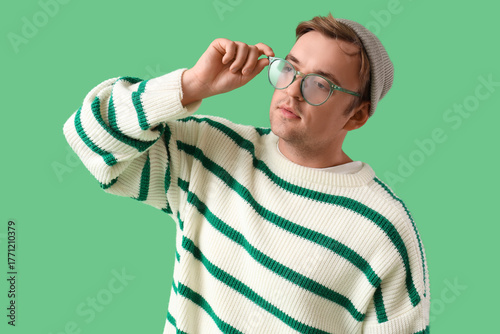Stylish young man in stripe...