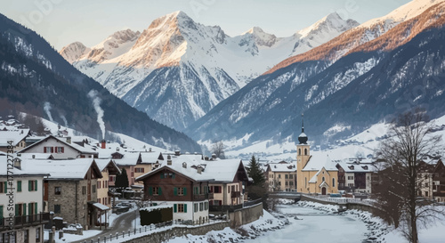 Picturesque mountain village covered in snow surrounded by the Alps range
