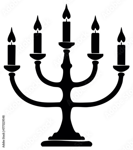 Silhouette of a vintage candelabra with five burning candles
