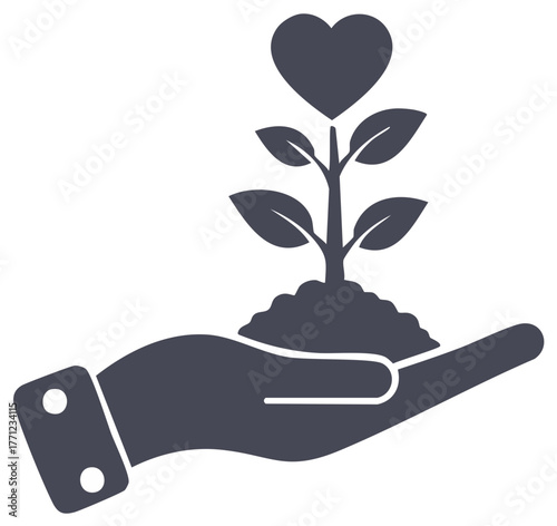 Hand nurturing a growing plant with a heart symbolizing love charity and new life