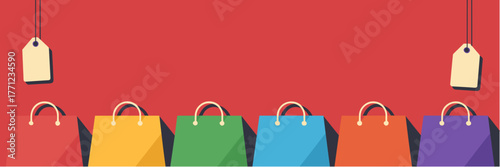 Colorful shopping bags with price tags on red background for sales