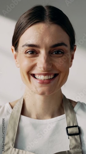 Young Caucasian woman in apron, preparing ingredients for Italian cuisine, rustic kitchen setting with natural lighting, International Day of Italian Cuisines theme