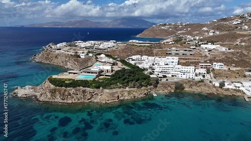 sunny clear blue coastal enclave of Mykonos, Greece, home of the rich and famous