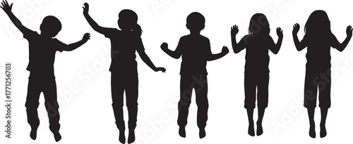 Children jumping and raising their arms in silhouette