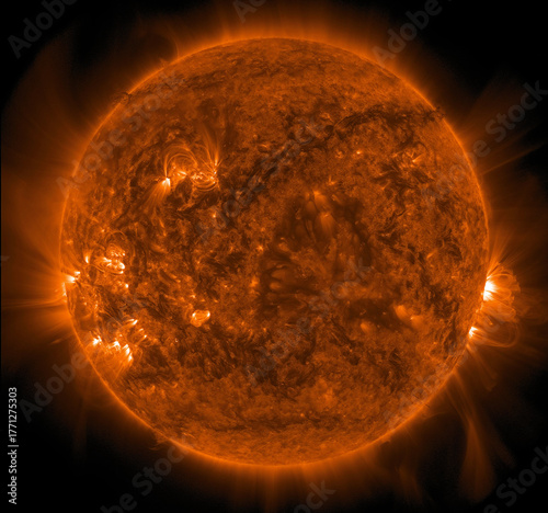 An active sun showing intense solar flares and complex coronal loops during a period of high solar activity.