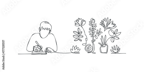 Person writing at desk with potted plants