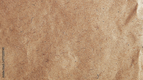 Brown background with a textured, paper-like appearance. The background is earthy and rustic, with a consistent brown color throughout. Brown paper textured background with copy space. Vector design.
