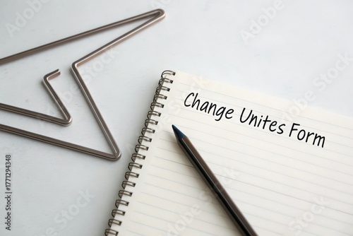 Wallpaper Mural A notebook with Change Unites F message pencil and unique paperclip Torontodigital.ca