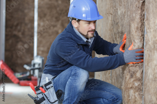 plasterer worker during insulation works