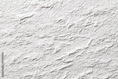 Textured, light gray stucco or stone wall surface
