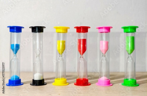 Hourglass 
They consist of two glass flasks connected by a narrow neck. Time is measured by the flow of sand from the upper flask to the lower one under the force of gravity.
