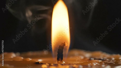 Candle flame burning bright close up macro shot for relaxation and meditation background footage