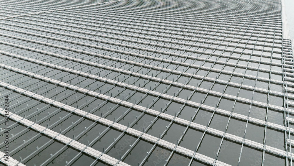 Fototapeta premium Water buoy platform array for Floating Solar Panel farm. Solar panel PV System in Industry lake