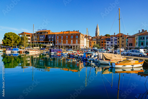 Scenic view of Marina Izola with yachts and boats parked at the docks. Bay with piers in the centre of Izola resort, Slovenia, Europe	