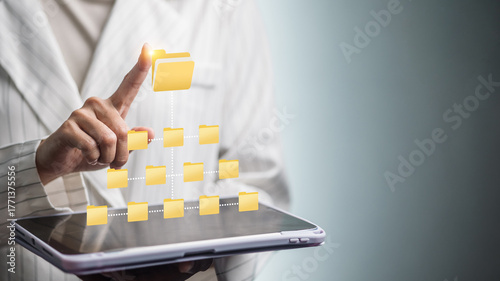 Naklejka Digital folder hierarchy on tablet, businesswoman tapping virtual file structure for document management