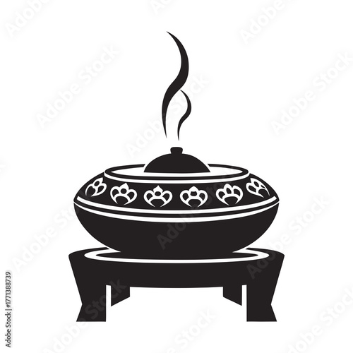 Traditional incense burner with smoke rising and decorative pattern. Incense burner features intricate design and serves aromatic purposes, enhancing relaxation and meditation experiences.