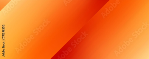 Warm orange yellow red gradient background. Autumn colored blurred wallpaper.
