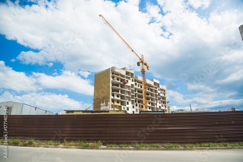 The architectural complex of residential buildings on sky background
