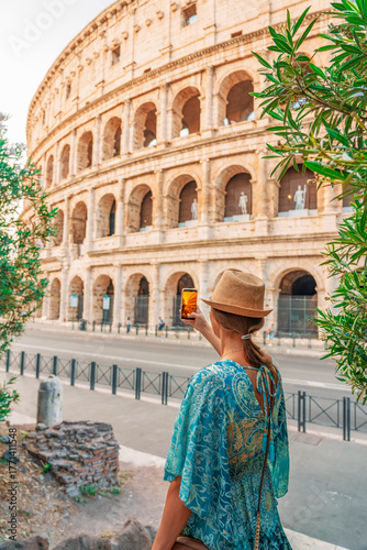 08 08 2025 Rome, Italy - Woman posing in front of Colosseum in summer
